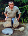 Rex holding Giant Stone tools