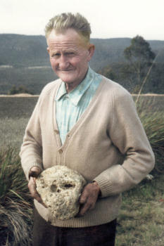 Mr W.F. [Bill] Gilroy Holding Skull
